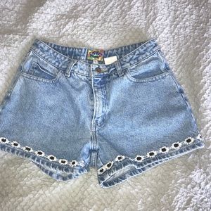 light washed jean shorts with flower details